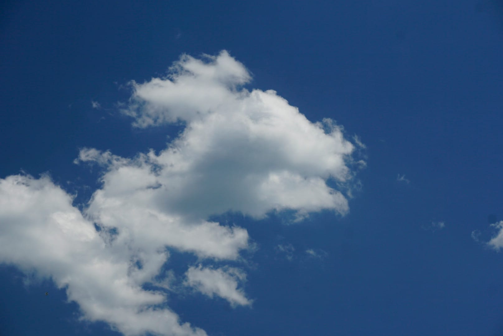 White clouds against a deep blue sky