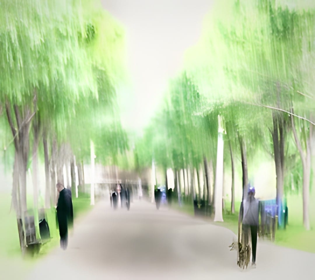 A tree lined park path with people, blurred vertically by intentional camera movement