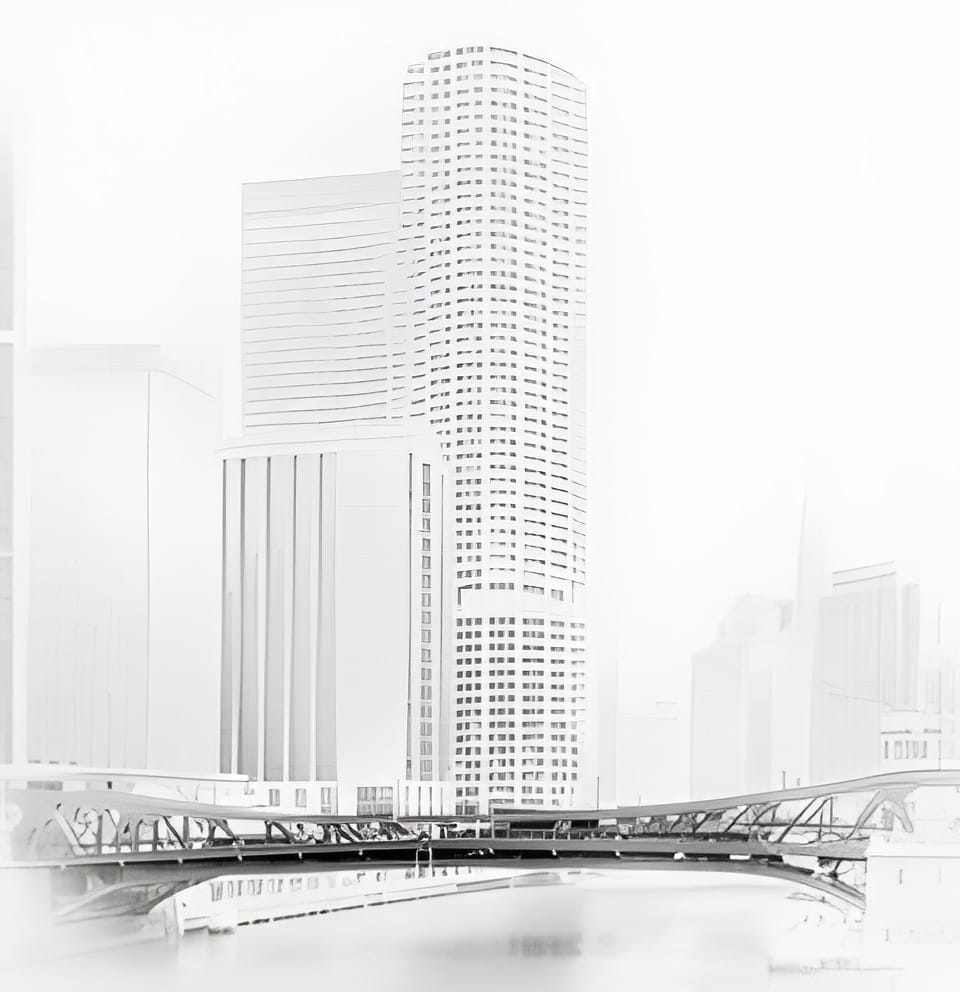 Marina City towers and a bridge dissolving into a bright white morning over the Chicago River