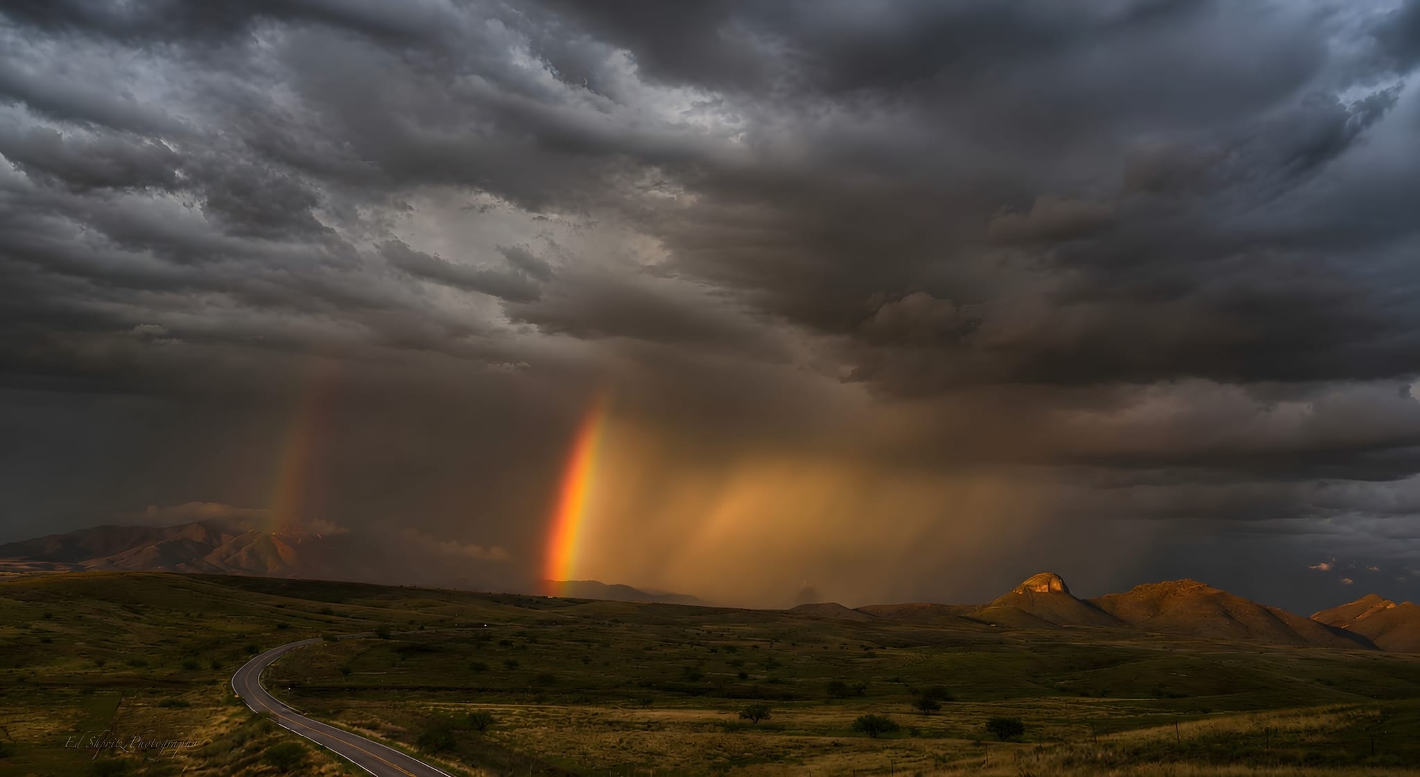 Storm and rainbow over the high desert — by Ed Shpritz