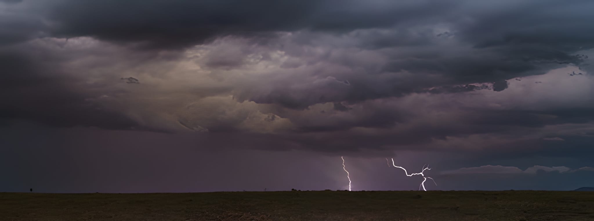 Twin lightning strikes over the plain — by Ed Shpritz