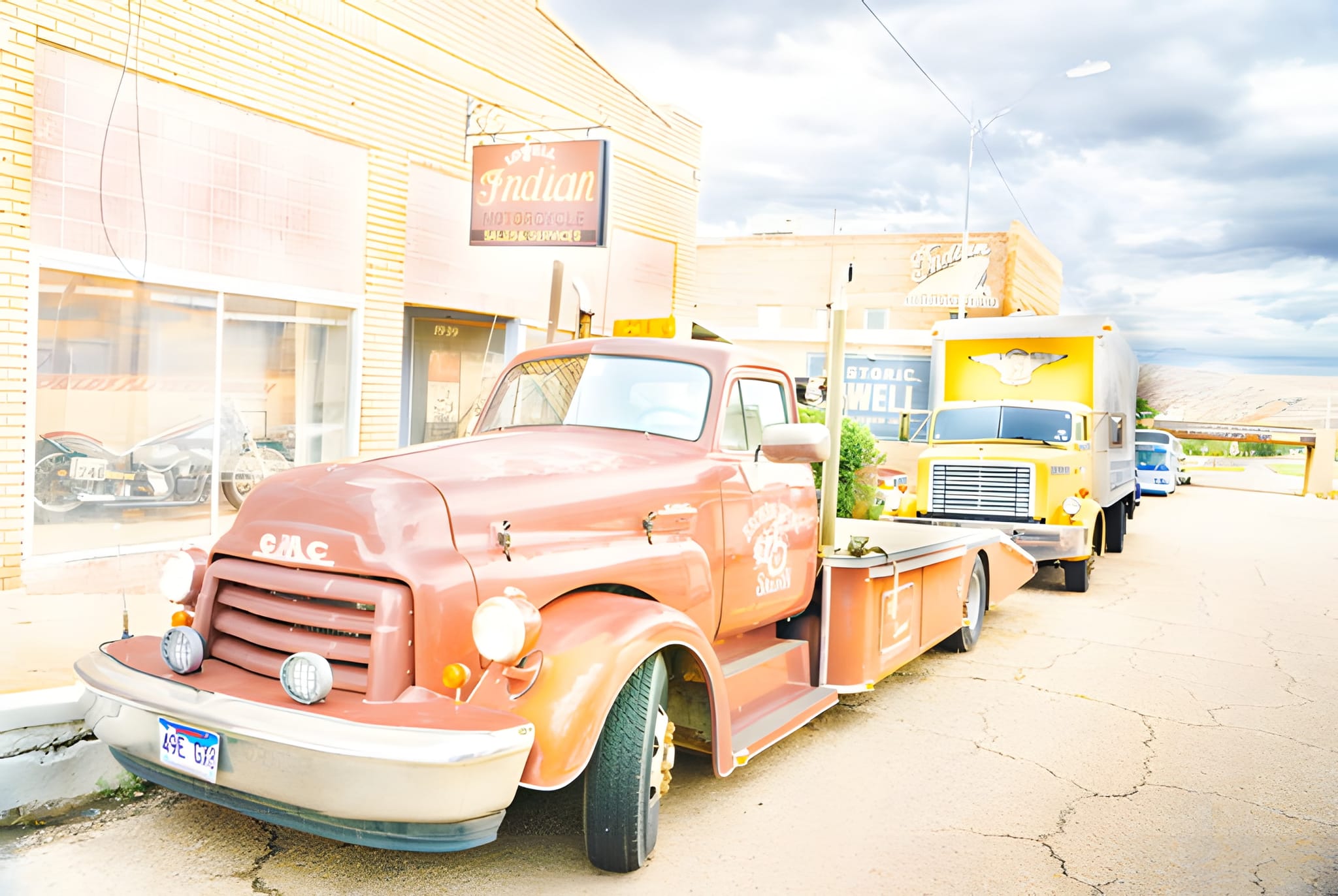 Indian Motorcycles storefront and a vintage truck, Lowell — by Ed Shpritz