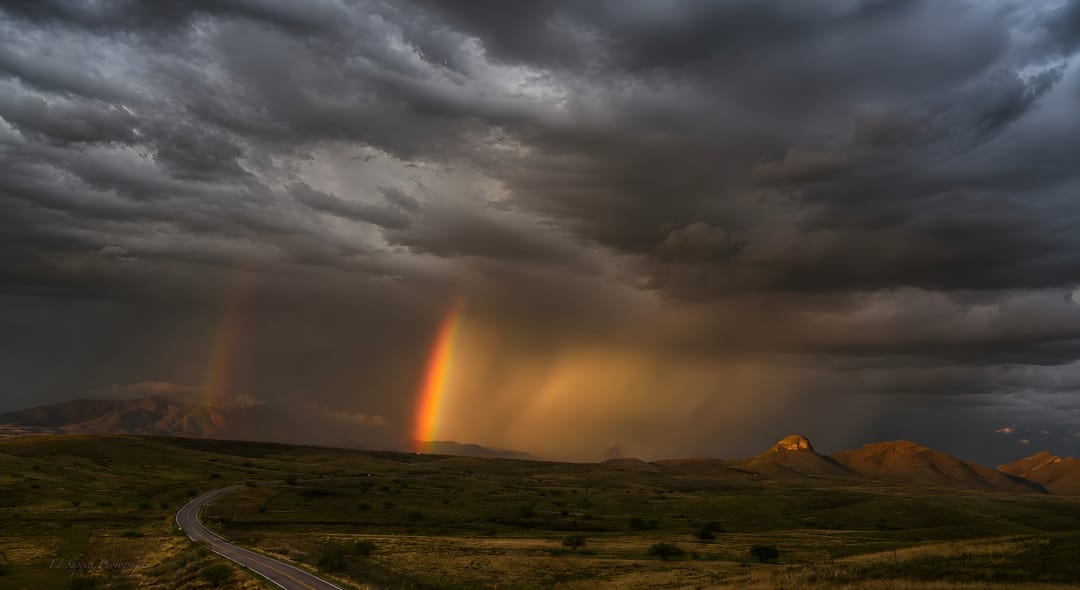 Storm and rainbow over the high desert — by Ed Shpritz