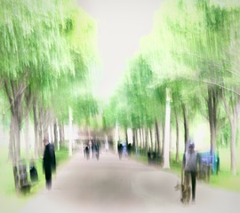 A tree lined park path with people, blurred vertically by intentional camera movement