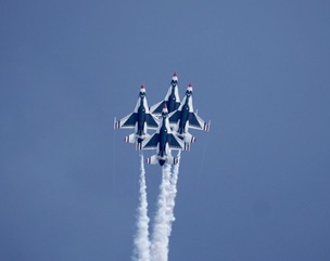 Four Thunderbirds jets in tight diamond formation